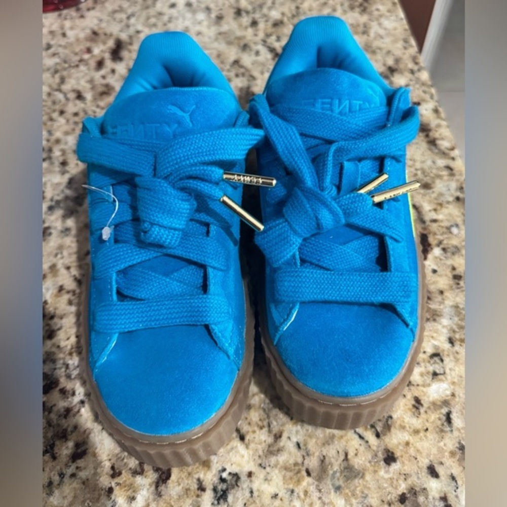 Puma Women's Vibrant Blue Sneakers with Gold Highlights